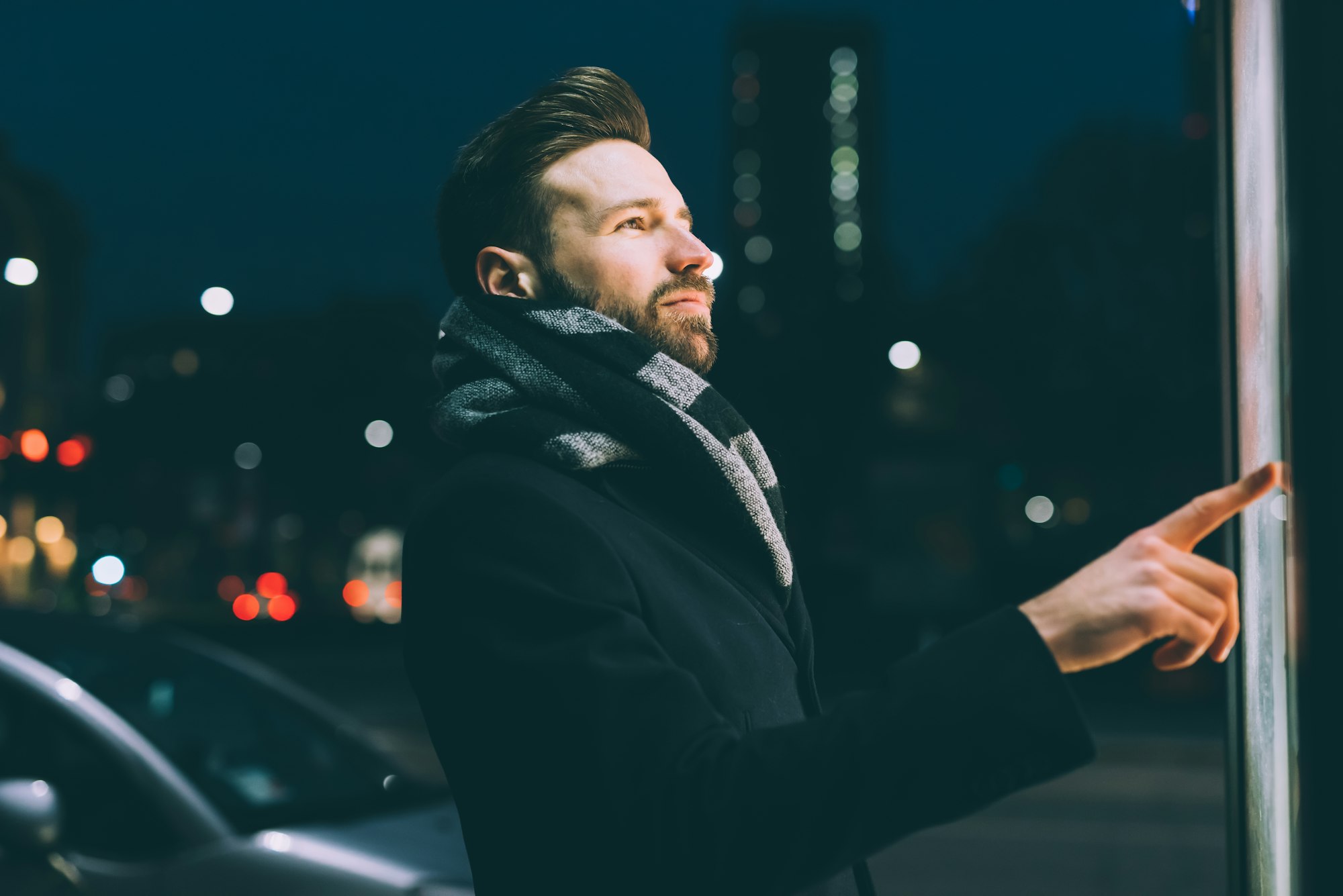 young bearded business man touch screen